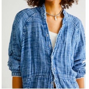 This is a long free people button down shirt. It has been washed but never worn